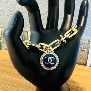 Elegant Gold Bracelet with Navy Charm